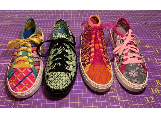 Finished patchwork quilted low top fabric sneakers.