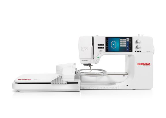 Adjustable fabric cutting edge alignment width controller wheel on a serger housing.