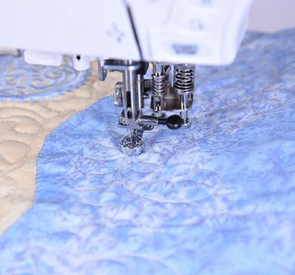 Janome specialized three-slot rolled hemmer funnel folder sewing machine presser foot.