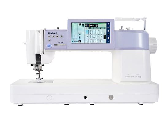 Janome Continental M6 high-speed professional sewing machine isolated on white.