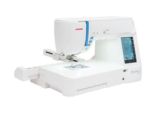 Janome Skyline S9 sewing and embroidery machine with embroidery arm attached, isolated on white.